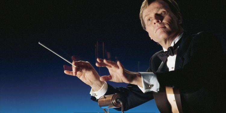 The Art of Conducting an Orchestra: Mastering the Baton